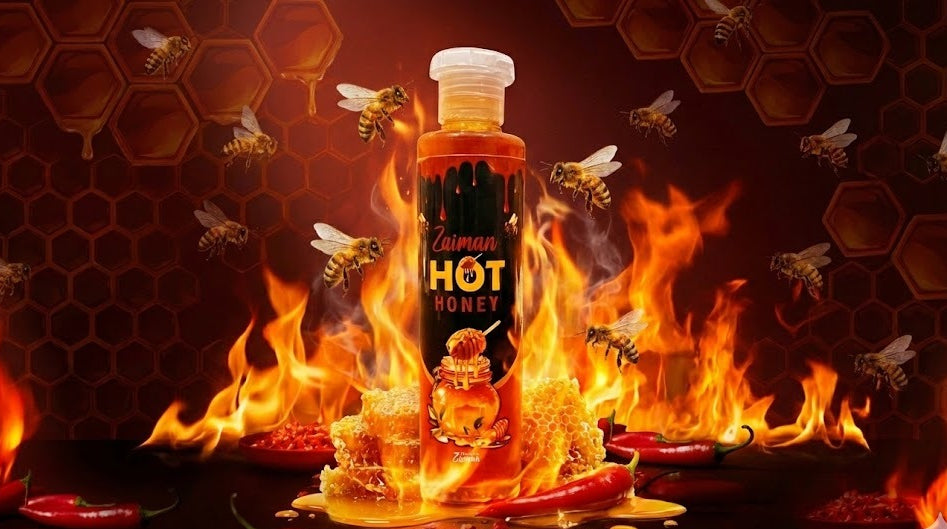 Bottle of Camman Hot Honey on fire with flames and bees around, against a honeycomb background.